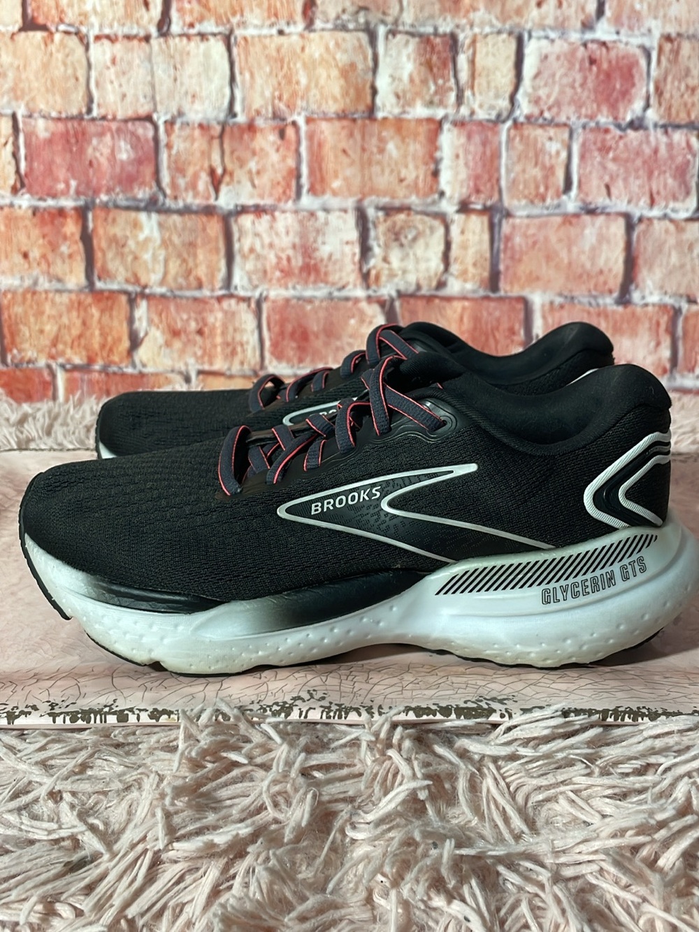 Brooks Black Running Shoes with White Soles and Red Trim